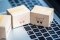Wooden blocks with pictures of shopping carts lie on a keyboard